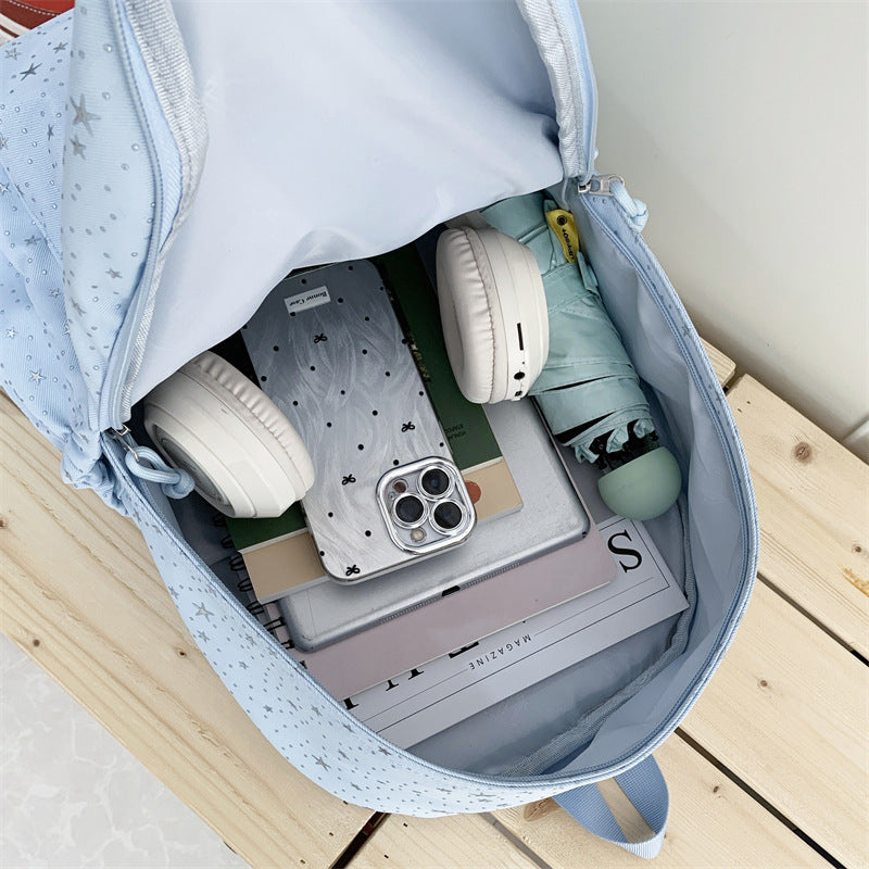 Elegant backpack with glittering stars and practical compartments