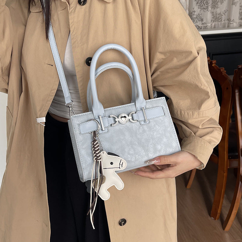 Women's handbag in modern minimalist style with playful charm