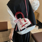 Women’s mini bag with playful design and charming details