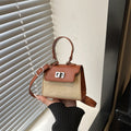Ladies mini handbag with luxurious leather look and practical carrying handles