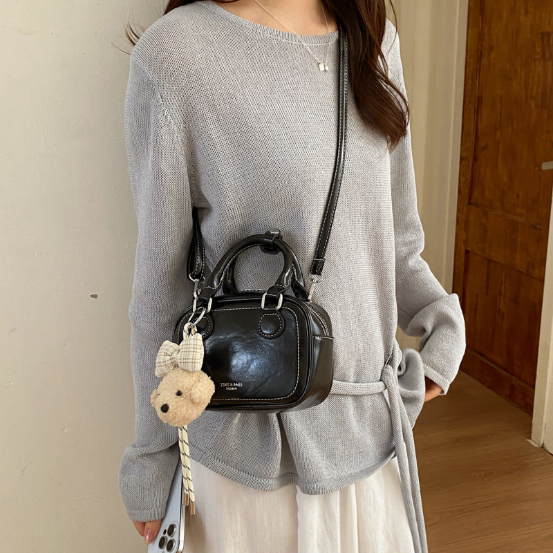 Women's mini handbag with detachable plush charm