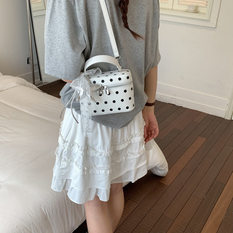 Women's mini handbag with playful design and elegant accents