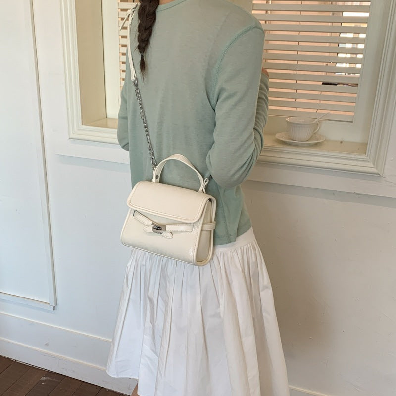 Ladies fashionable mini handbag with decorative magnetic closure