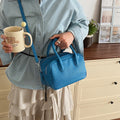 Women’s mini handbag with textured artificial leather and elegant design