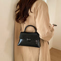 Women's handbag with textured design and elegant closure