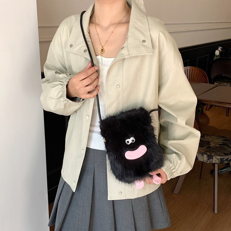 Plush shoulder bag with unique character design