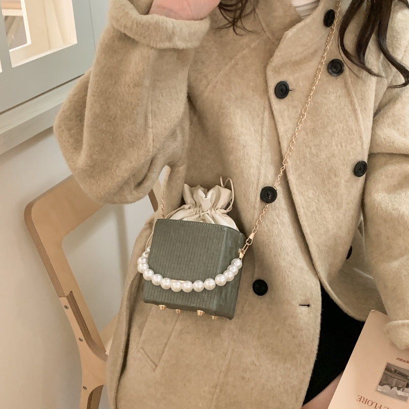 Ladies stylish mini handbag with drawstring and pearl accent