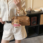 Women's mini handbag with charming animal pendant
