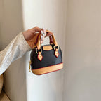 Women’s mini hobo bag made of textured synthetic leather with golden accents