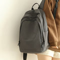 Practical everyday backpack with reinforced bottom and versatile compartments