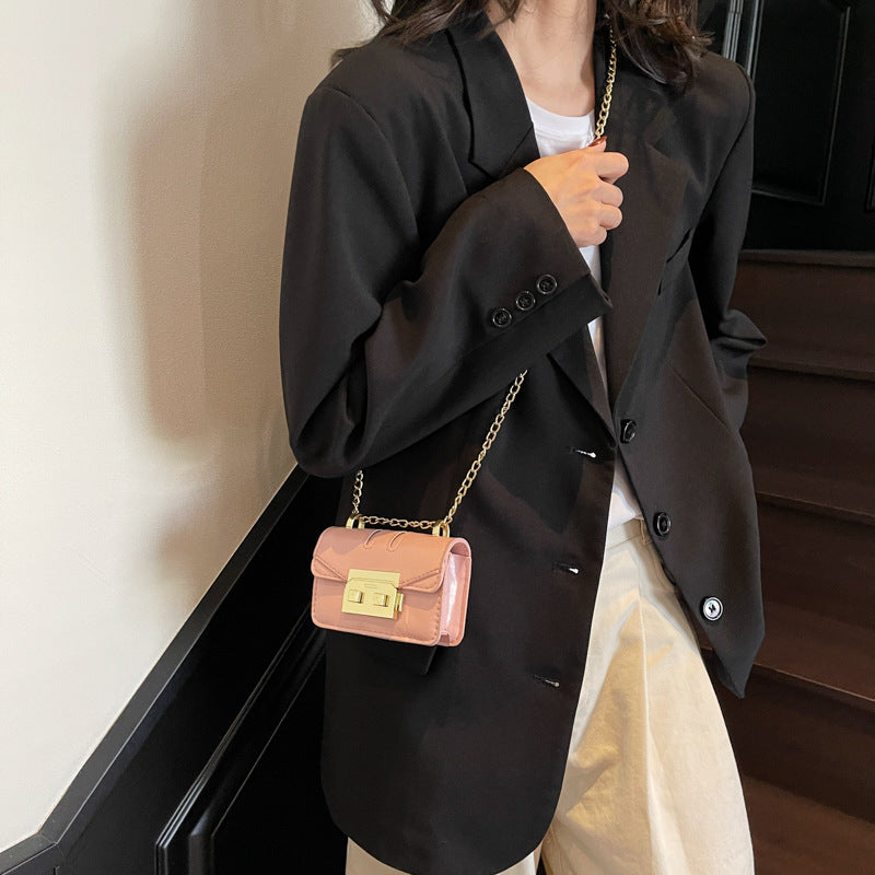 Women's elegant mini handbag with gold fastening mechanism