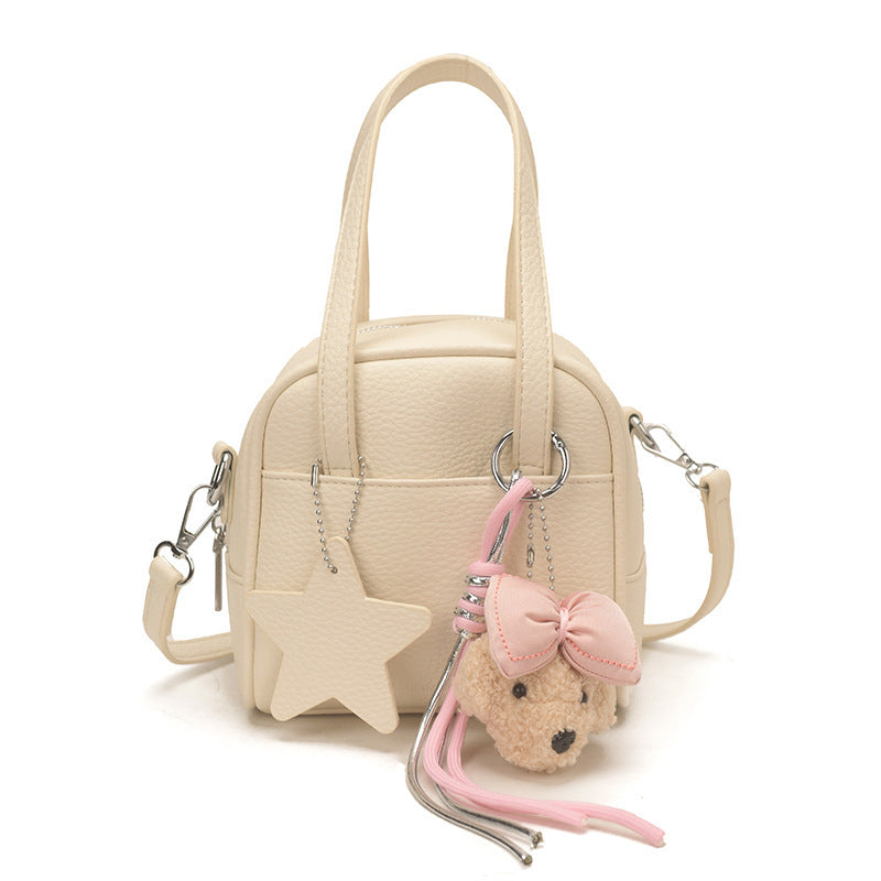 Ladies mini bag with decorative pendant