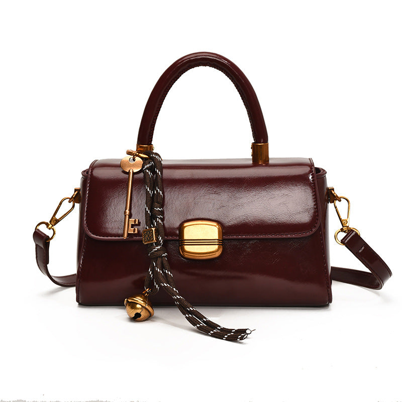 Women's elegant handbag with golden accents