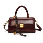 Women's elegant handbag with golden accents