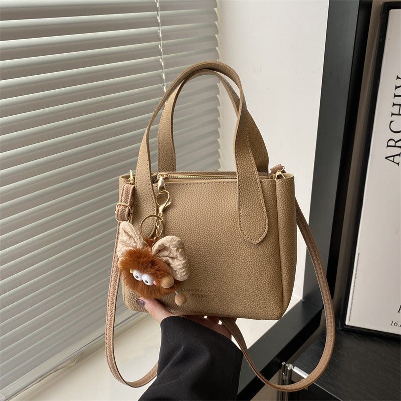 Women’s mini bag with playful animal pendant