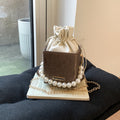 Ladies stylish mini handbag with drawstring and pearl accent