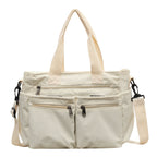 Durable shoulder bag with multiple compartments