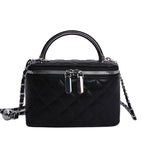 Women's mini handbag with gold chain accent and textured design