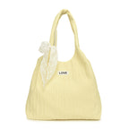 Leisure bag with structured design and playful scarf