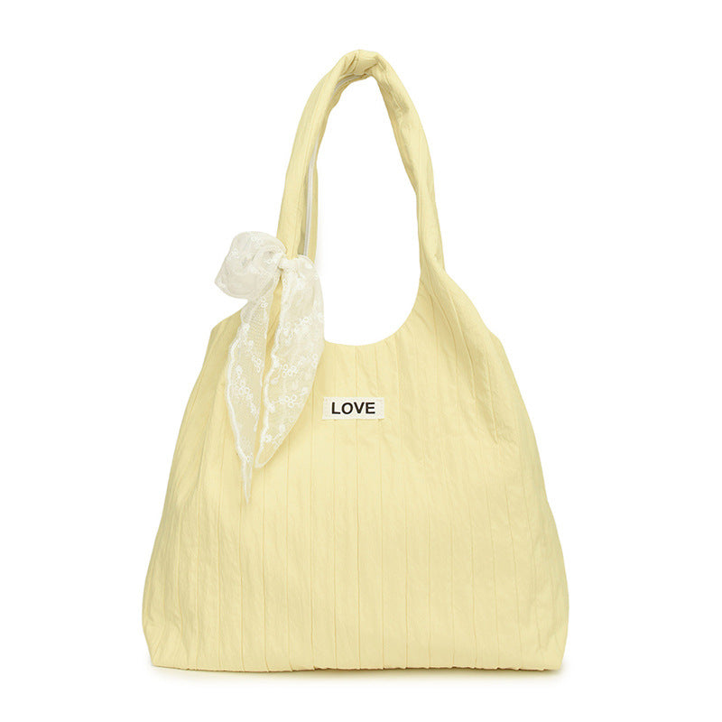 Leisure bag with structured design and playful scarf
