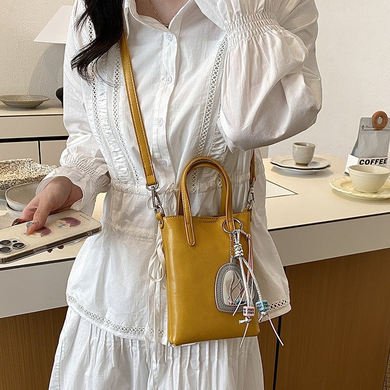 Ladies mini handbag with elegant pendant