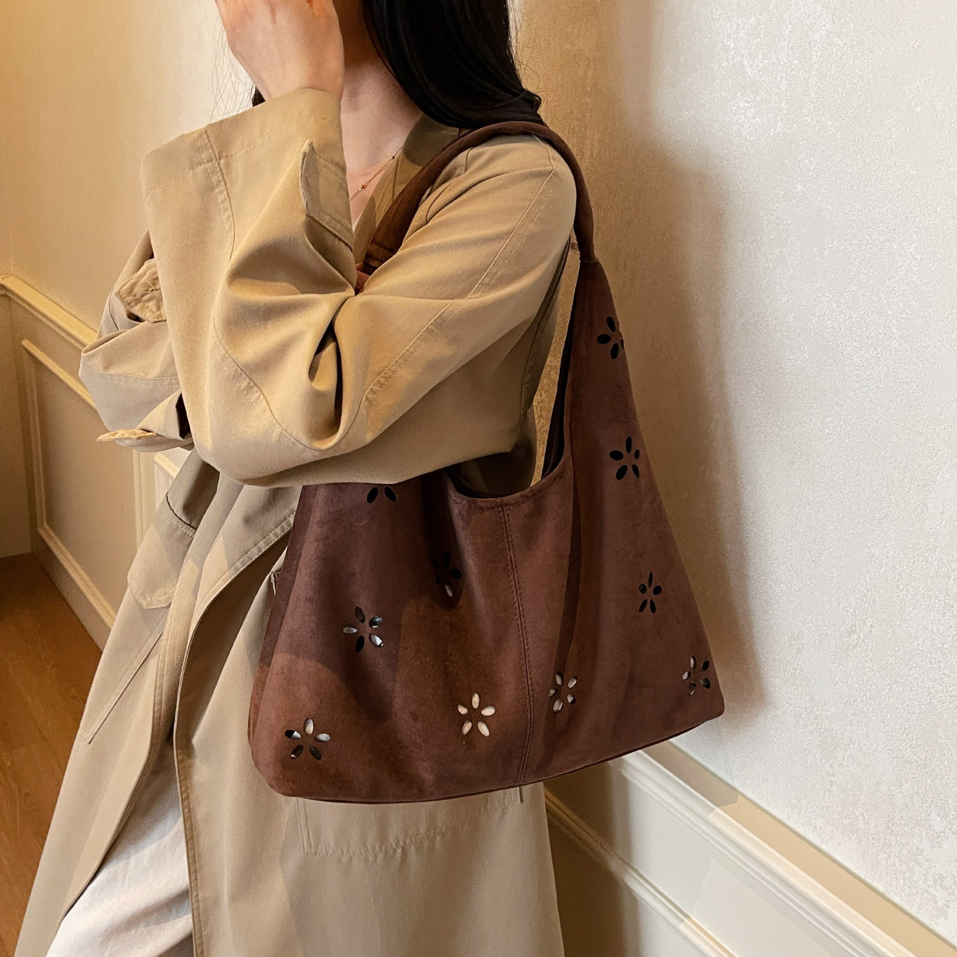 Women's hobo bag with floral accent and practical mini wallet