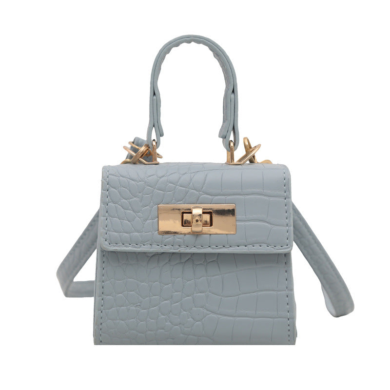 Ladies mini bag with elegant crocodile look and golden accents