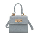 Ladies mini bag with elegant crocodile look and golden accents