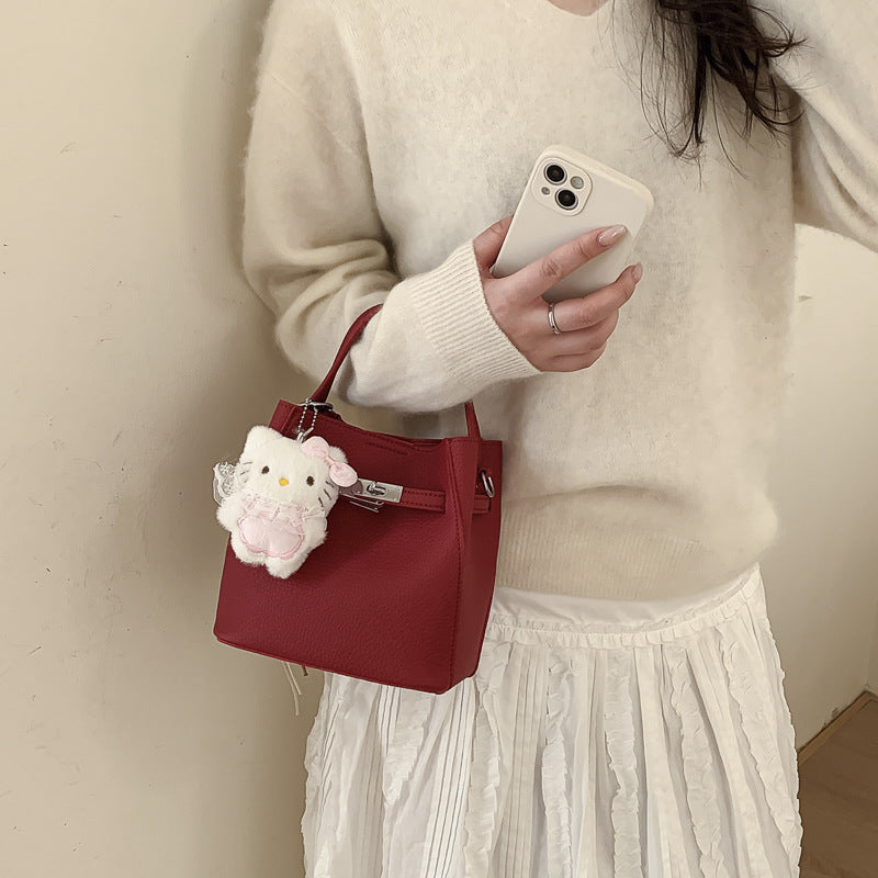 Women's mini handbag with cute charm