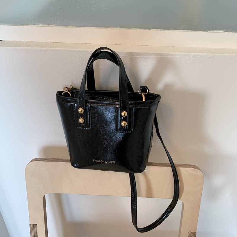 Women's mini bag with elegant structure and practical carrying handle