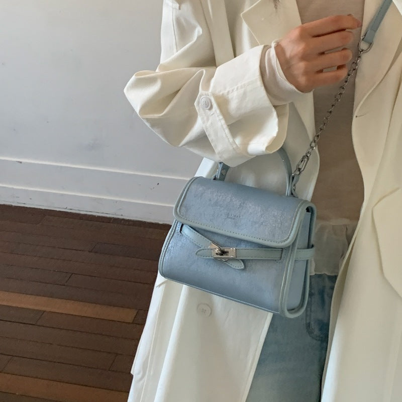 Ladies fashionable mini handbag with decorative magnetic closure