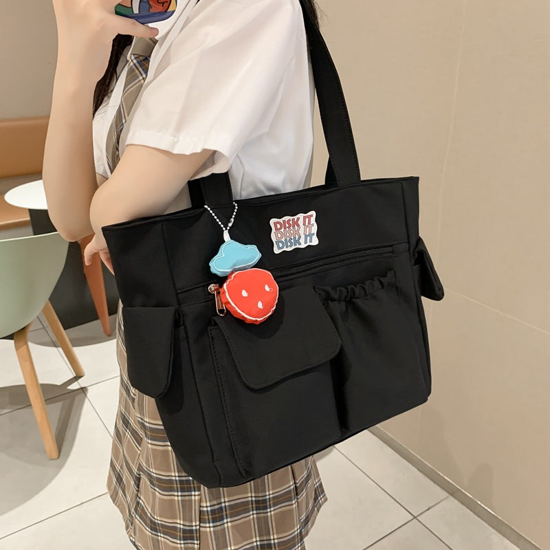 Tote bag with versatile compartments and ergonomic design