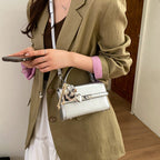 Women's mini crossbody bag with playful charm