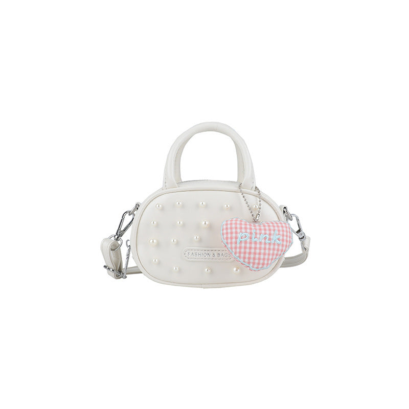 Ladies trendy mini handbag with striking pearl applications