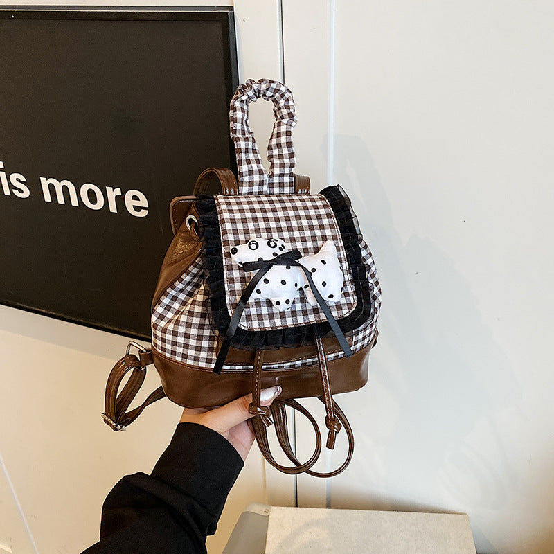 Playful backpack with checkered pattern and animal appliqué
