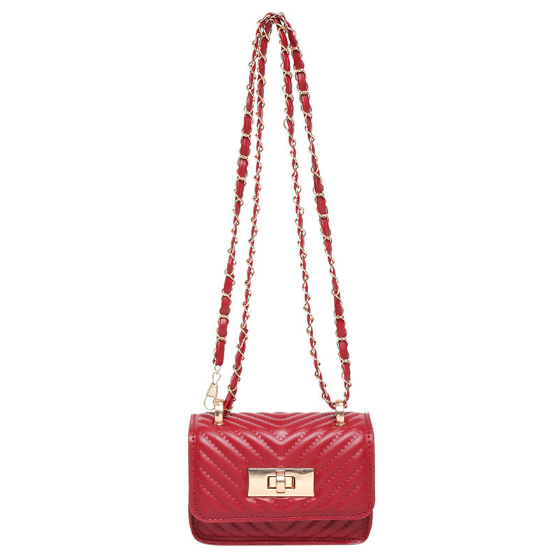 Women’s mini handbag with quilted design and golden clasp