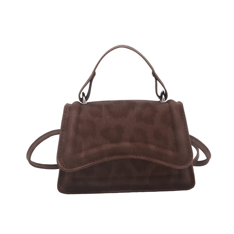 Ladies' mini handbag in retro style with removable shoulder strap