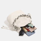 Women's mini backpack bag with elegant chain handle and fine texture