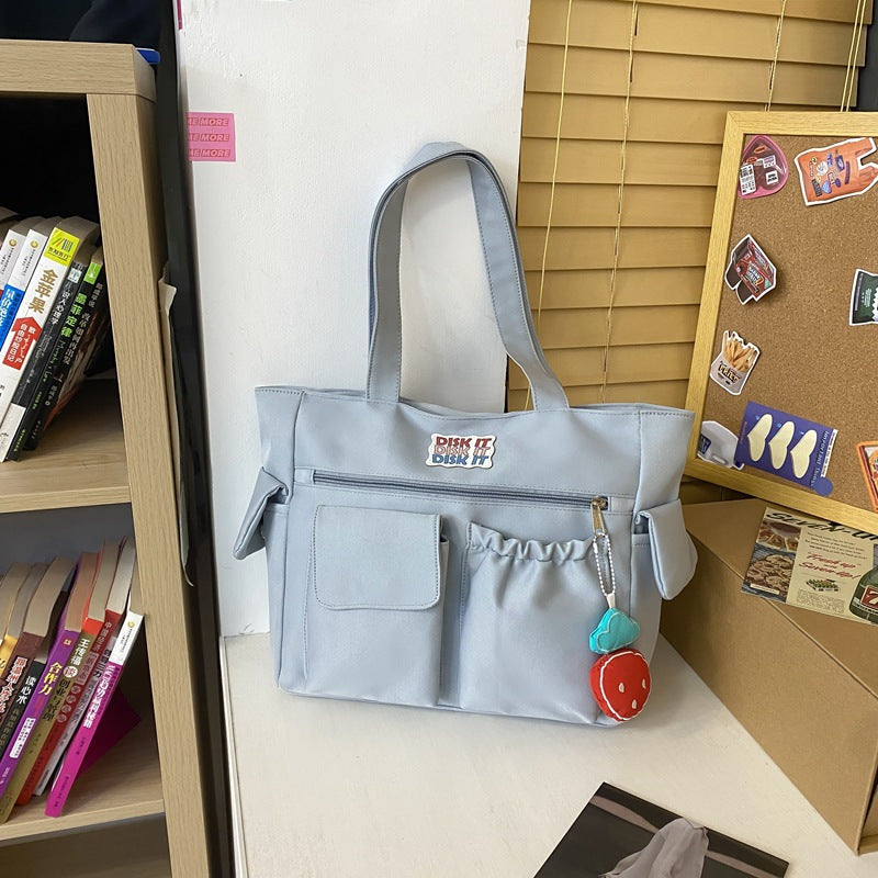 Tote bag with versatile compartments and ergonomic design