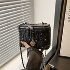 Women's mini handbag with elegant quilting and chain pendant