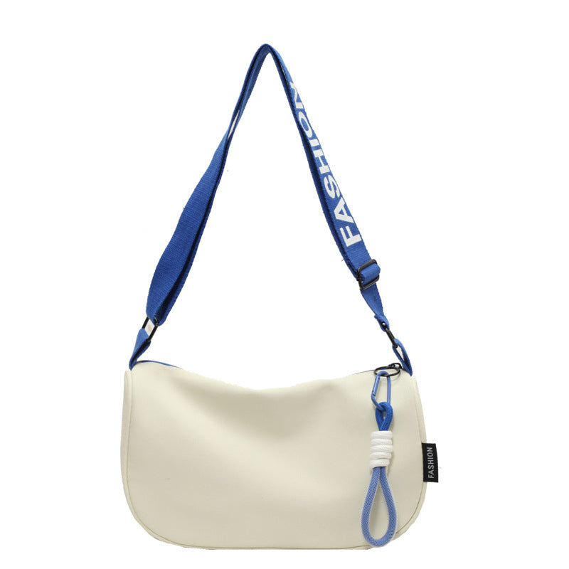 Fashionable shoulder bag with adjustable carrying strap