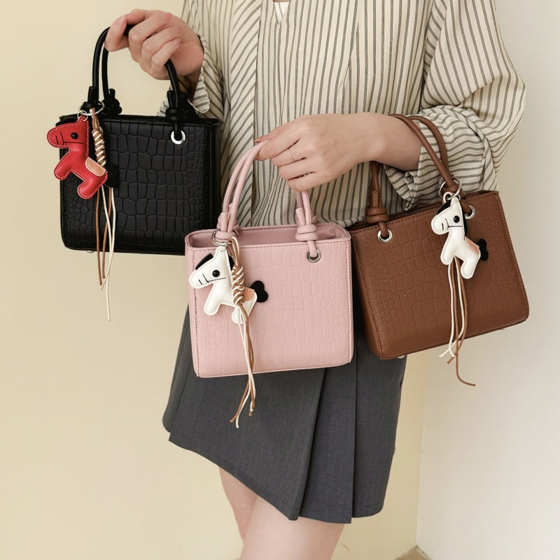 Women's mini bag with animal charm and modern crocodile look