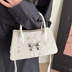 Ladies mini bag with floral woven design and stylish bow detail