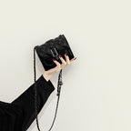 Women’s mini clutch with elegant chain strap and luxurious quilted pattern