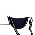 Fashionable shoulder bag with unique cut and adjustable strap