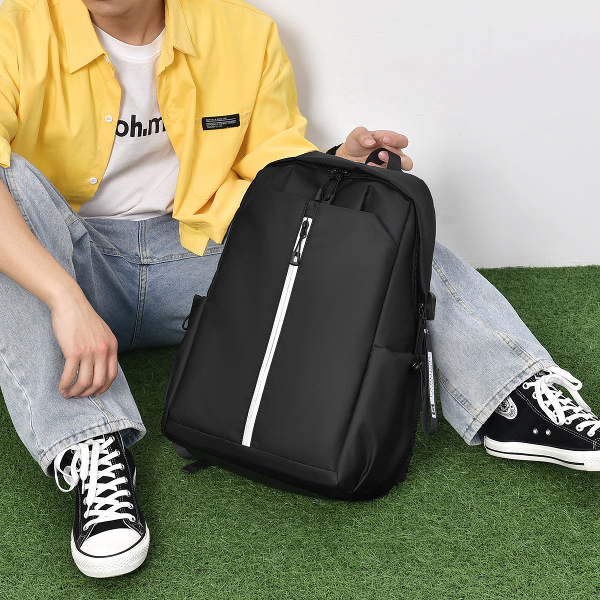 Functional backpack with ergonomic design and zippered compartments