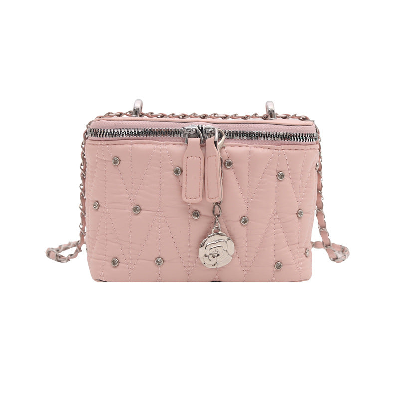 Women's mini handbag with elegant quilting and chain pendant