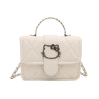 Ladies mini handbag with decorative quilting and playful cat motif