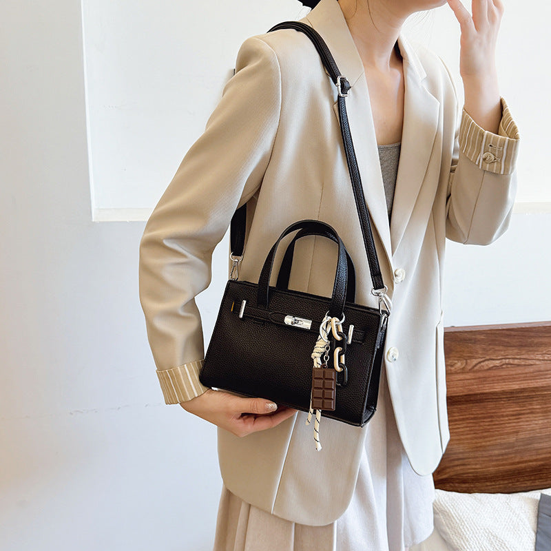 Ladies elegant mini bag with detachable pendant