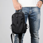 Sling backpack with multiple compartments